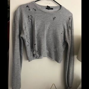 Distressed cropped sweater